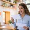 Woman reacting to average tax refund 2026 notice while reviewing mail at home
