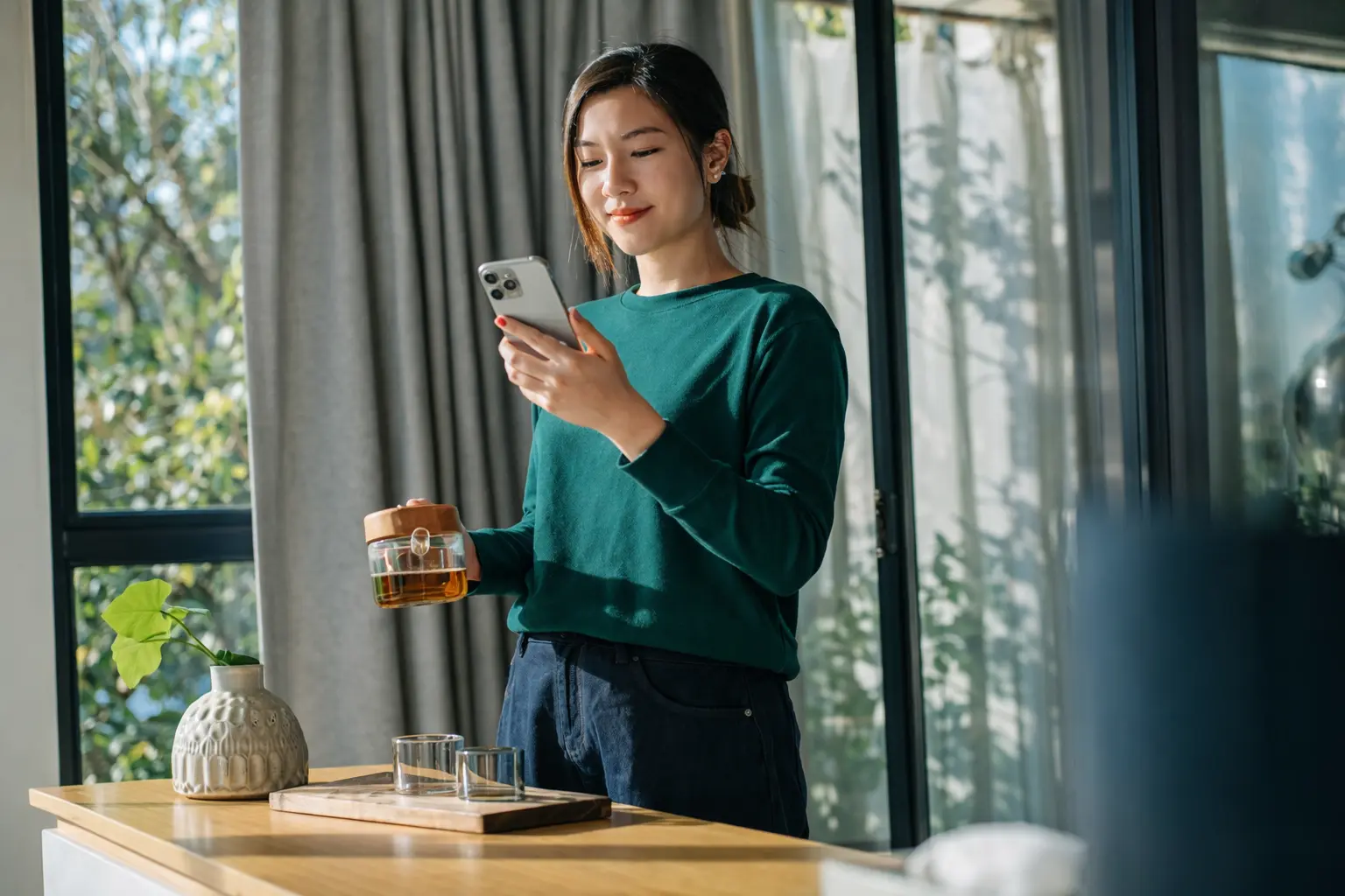 Woman checking bank app early morning during Friday direct deposit cutoff window