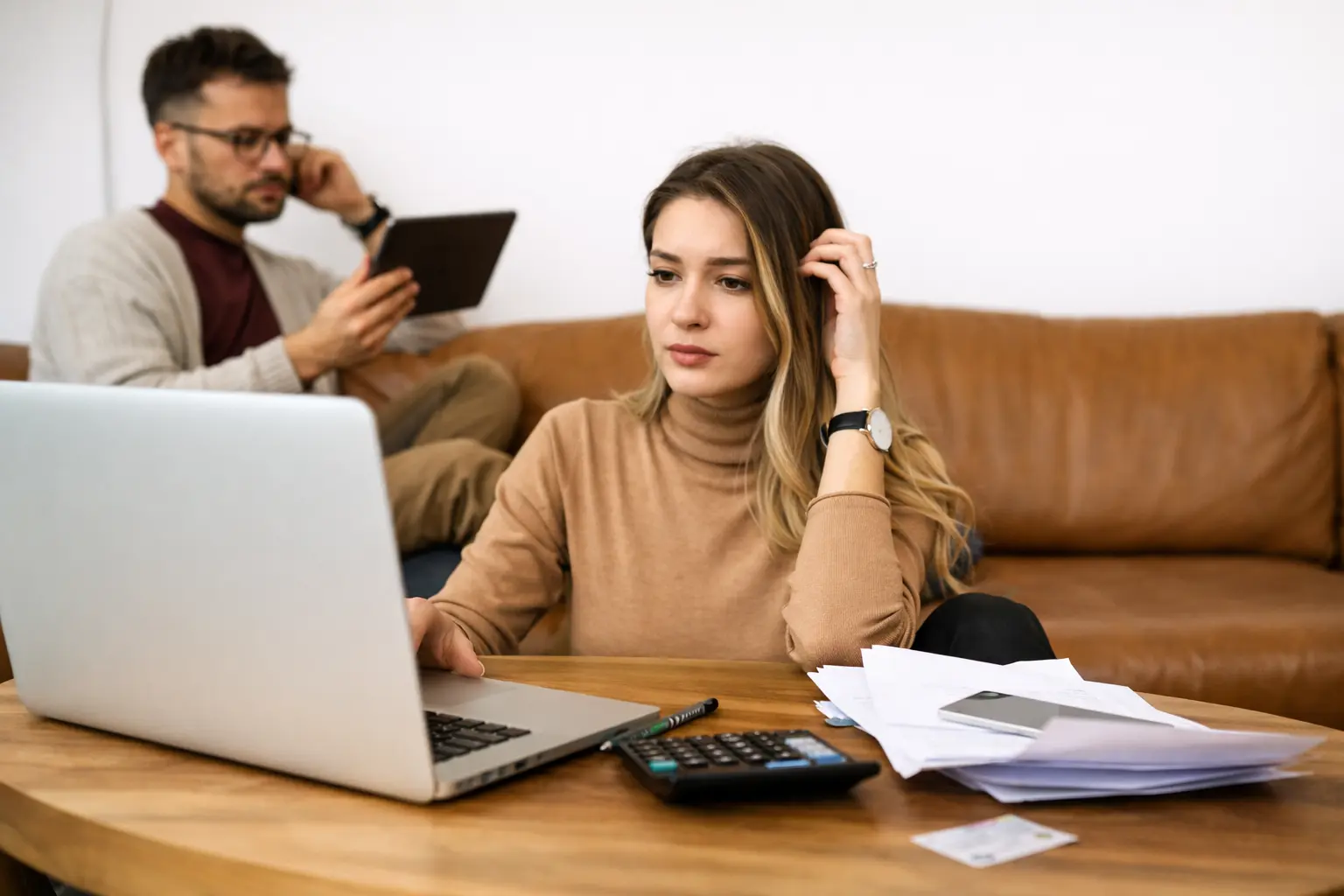 Middle-class woman reviewing household finances at home as the margin collapse narrows financial buffers