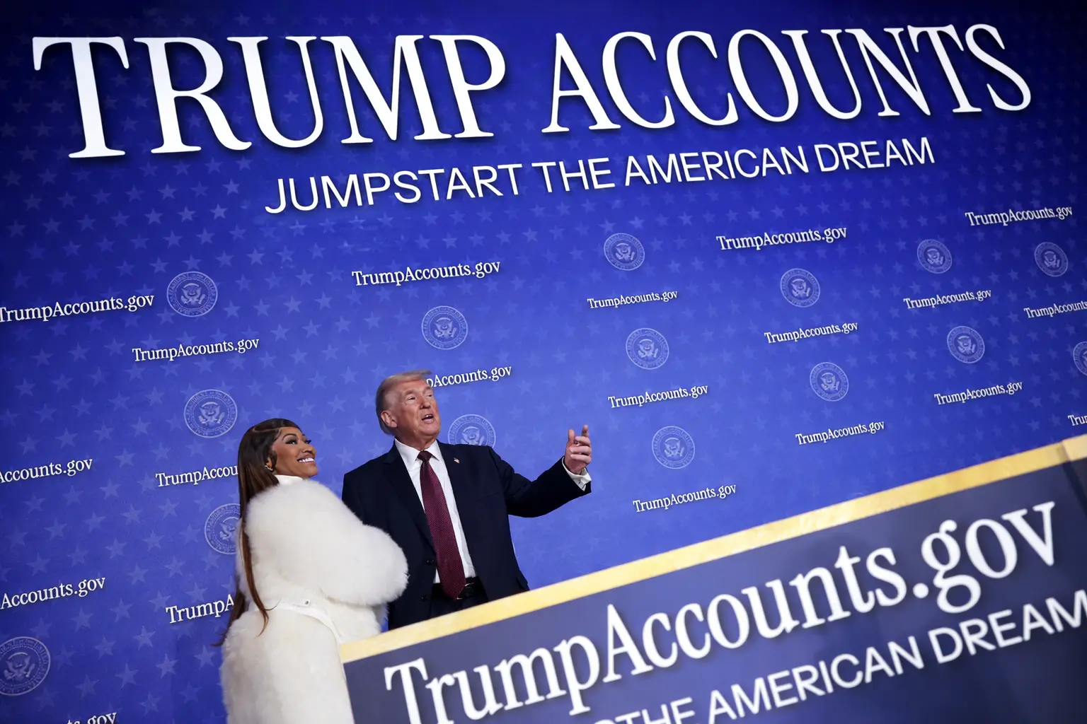 A close-up of a digital tablet displaying the new IRS Form 4547 for Trump Account elections, placed next to a baby’s pair of shoes and a tax return, symbolizing the 2026 pilot program.