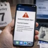 Person checking smartphone showing SSA national system alert as Social Security payment is missing on March 7
