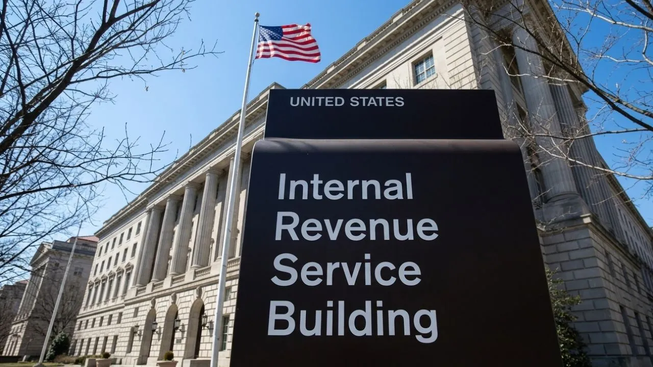 Person at home desk in morning light reviewing IRS tax transcript on laptop screen showing TC 846 refund sent and TC 776 interest credited codes with generic dollar amounts