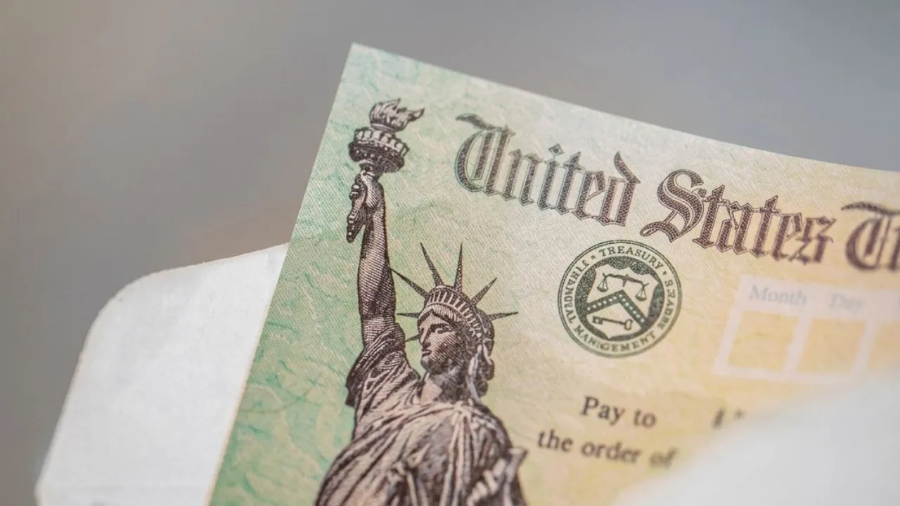 Person at kitchen table reviewing IRS CP53E notice about refund sent to wrong bank account in 2026, same process applies to social security and federal payment recipients