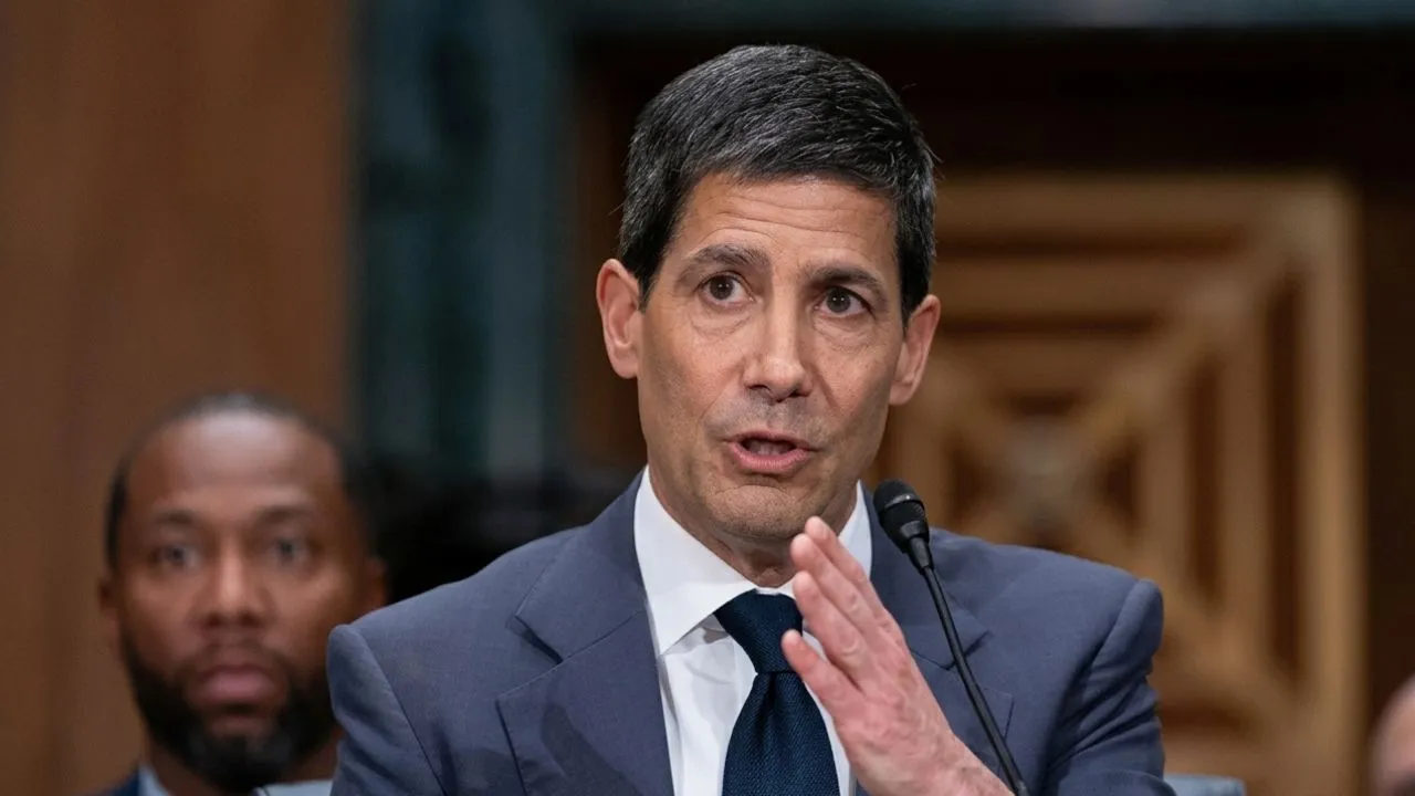 Empty Federal Reserve Board meeting room with Kevin Warsh and large conference table, leather chairs, and the Federal Reserve Seal visible