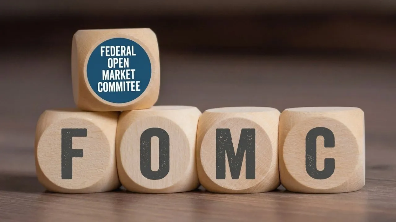 Close-up of a 2026 calendar on a conference table with four FOMC meeting dates circled in red marker representing the remaining Federal Reserve rate decision meetings of the year