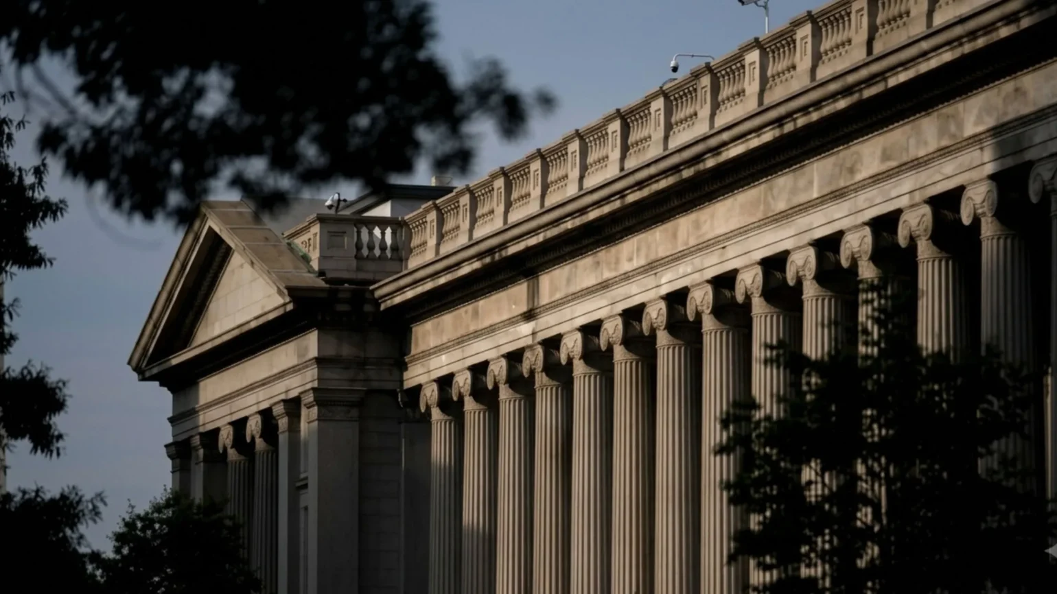 Federal Reserve Bank of New York building with a large digital balance display representing the Treasury General Account cash position affecting federal liquidity in 2026