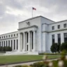 Federal Reserve building exterior with American flag, representing the system behind federal payment settlement