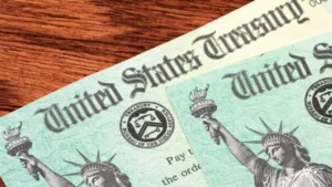 Latest U.S. Financial News and Analysis 10 Illustration of an envelope, clock, and bank icon representing IRS refund delays tied to CP53E notices