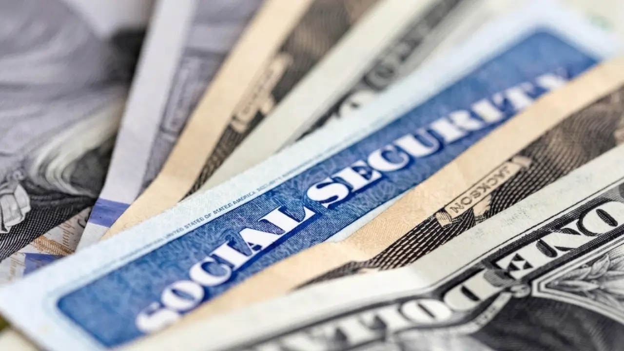Social Security card and calculator representing 2027 cost-of-living adjustment estimates