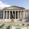 Exterior view of the U.S. Treasury Building in Washington, D.C., the department responsible for managing federal debt, government borrowing, and Treasury payments.