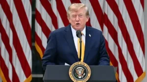 Latest U.S. Financial News and Analysis 3 President Donald Trump speaking at a podium with American flags behind him