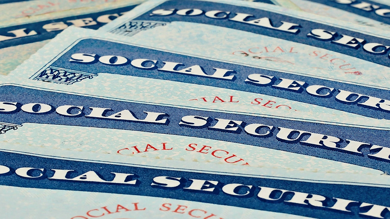 Close-up photo of several Social Security cards overlapping each other.