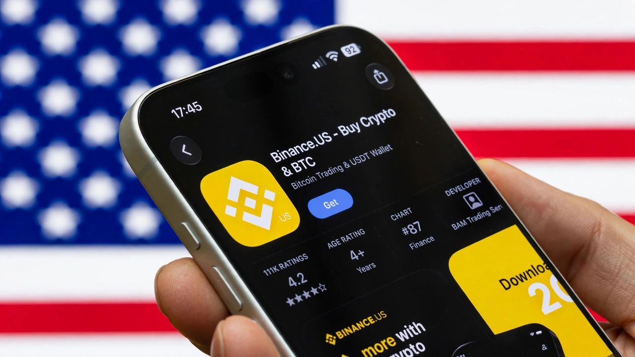 Smartphone displaying the Binance.US cryptocurrency app against a blurred American flag.