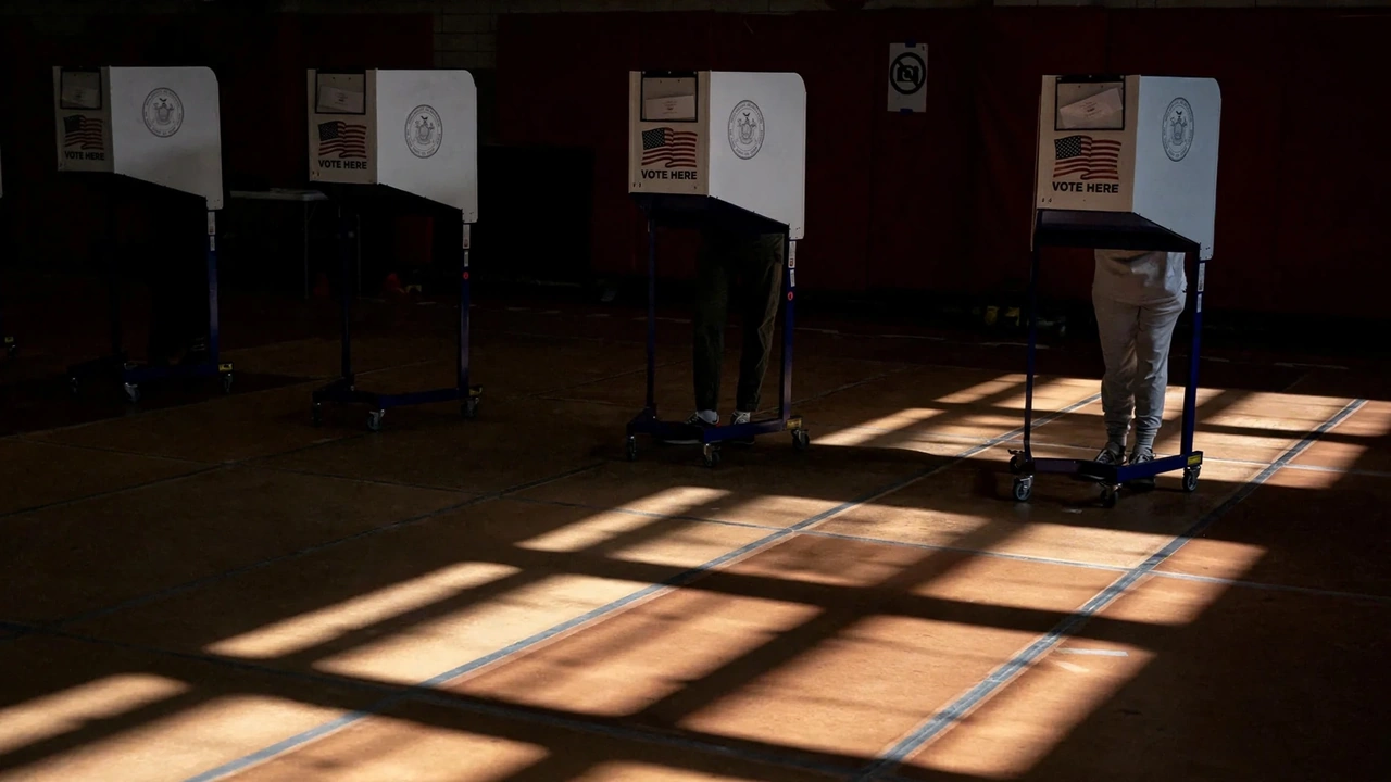 Voters cast ballots at voting booths inside a U.S. polling location