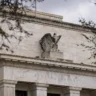 Federal Reserve building in Washington, D.C., with the stone eagle sculpture above its entrance.