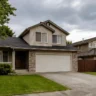 Suburban homes with driveways illustrating the 2027 U.S. mortgage origination forecast