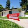 Red open house sign outside a U.S. home as mortgage rates reach 7.49%